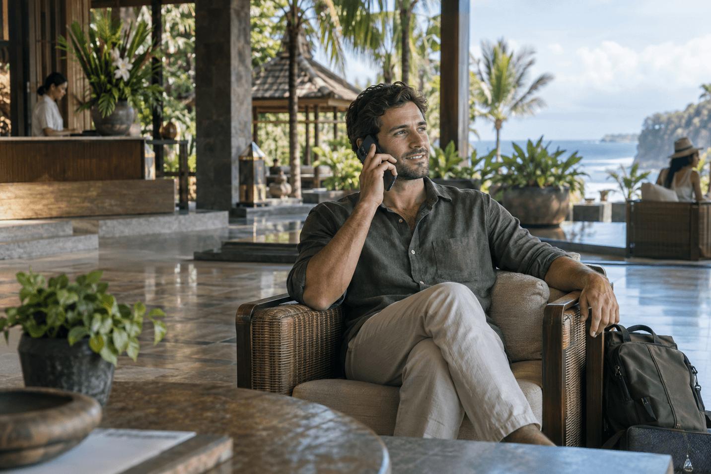 Traveller on a call from a resort lounge while abroad