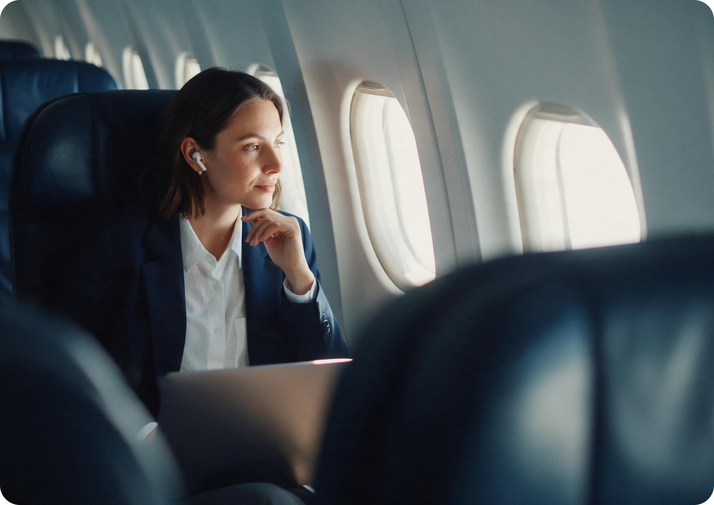 Traveler looking out an airplane window