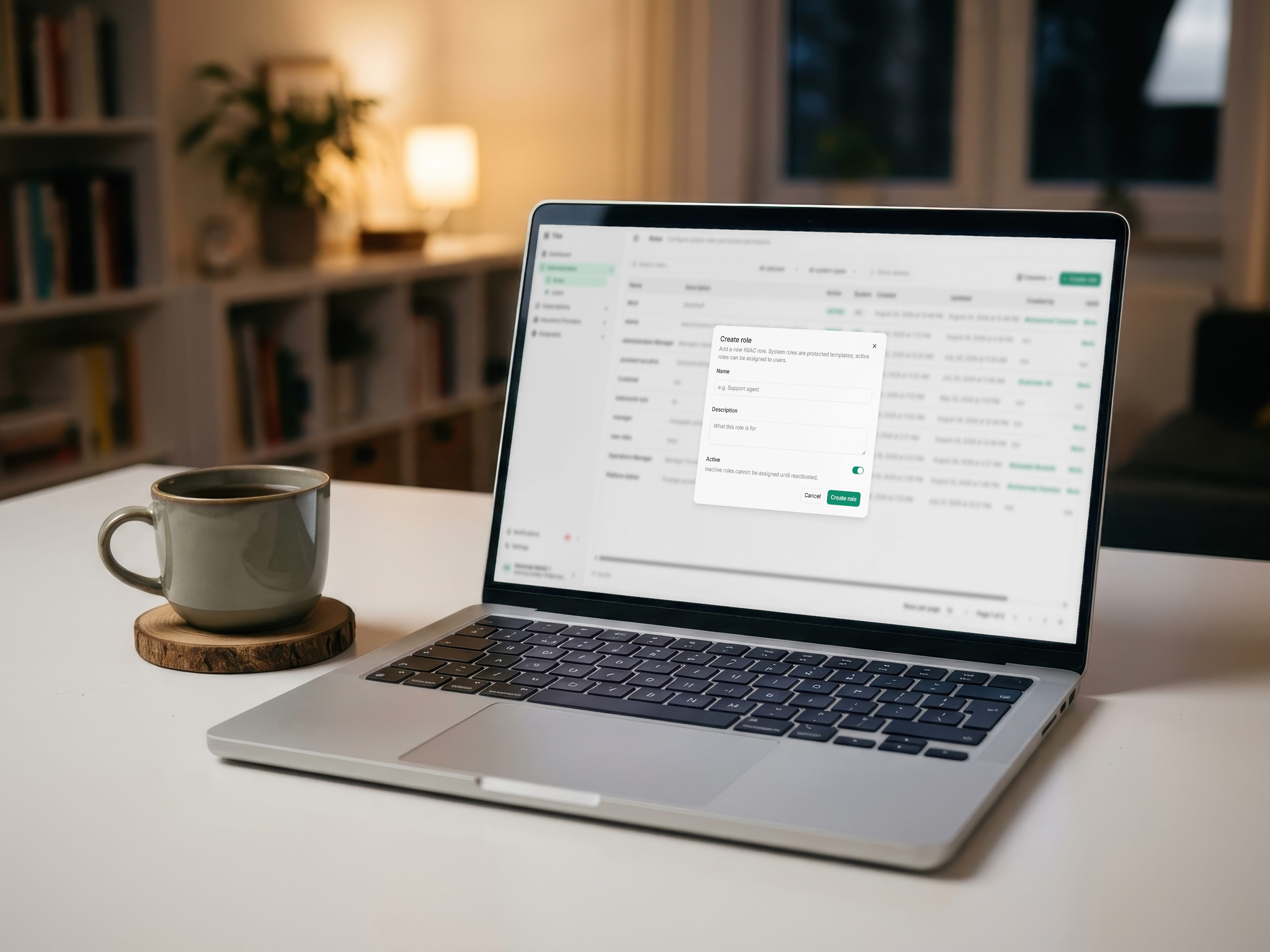 Laptop on a desk showing the Tiba agent portal invite flow